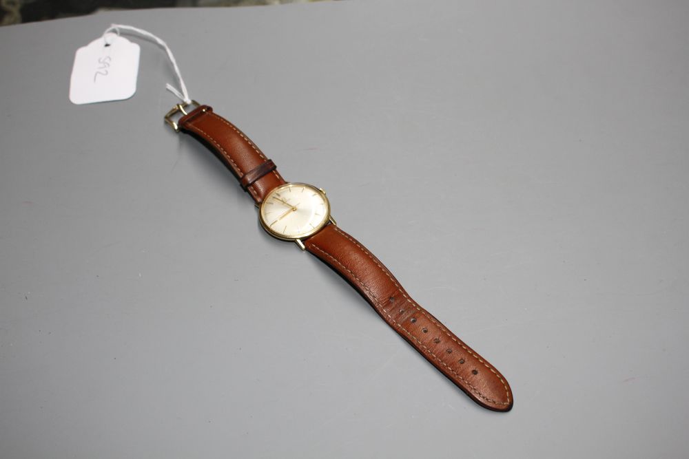 A gentlemans Omega manual wind wrist watch, on associated strap,